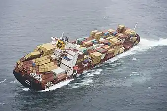 Grounded container ship, the MV&nbsp;Rena off New Zealand, 5 October 2011. Some of the bottom containers collapsed, but many twistlocks held, resulting in the cargo stacks falling over.