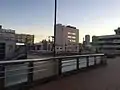 The elevated entrance and pedestrian walkway connecting with JR Higashi-Kanagawa station in January 2015