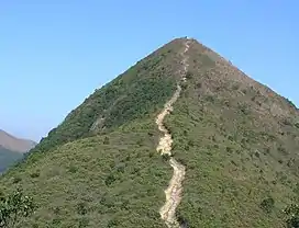 Steep mountain with clear dirt path leading to summit