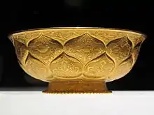 Tang era gilt-gold bowl with lotus and animal motifs