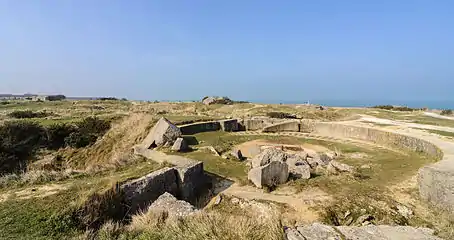 Part of the modern day site, with the remains of a gun pit in the foreground.