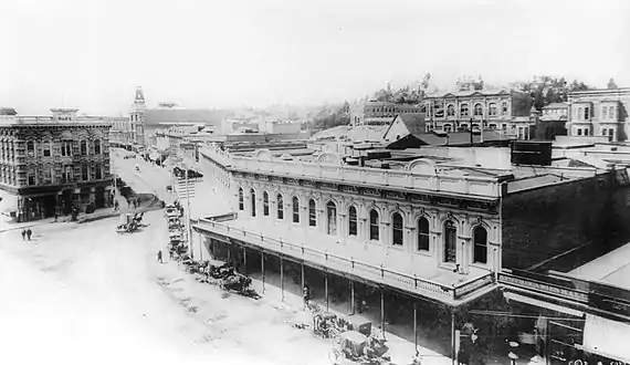 North end of the Downey Block along the west side of Main St., 1887. Temple Block at left; Spring Street runs towards the Phillips Block (tower) in the background at center-left.