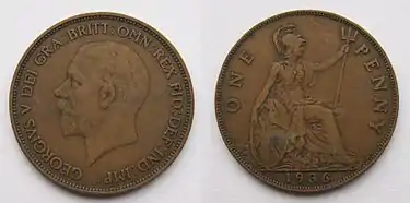 Both sides of an old, large British penny dated 1936