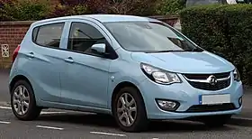 Small five-door car with alloy wheels, fog lamps, door mirrors, flush headlights, and a fuel-filler cap located on the right-hand side