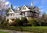 225 Elm Street, Northampton, MA.  Built 1907.  Queen Anne yellow brick and brown shingle.