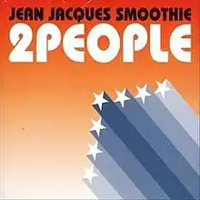 The single cover, showing the song title and artist name, as well as seven white stars, in front of a gradient orange background