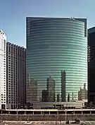 Image of tall building with reflecting skyline