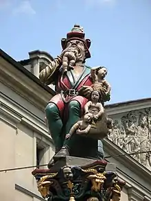 Ogre Fountain (lit. "Child Eater Fountain") at Corn House Square, Bern , Switzerland .