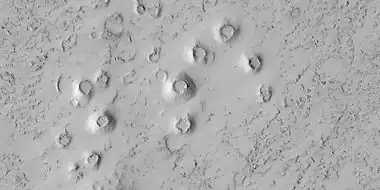 Close view of cones, as seen by HiRISE under HiWish program These cones probably formed when hot lava flowed over ice-rich ground.  The location is the Elysium quadrangle.