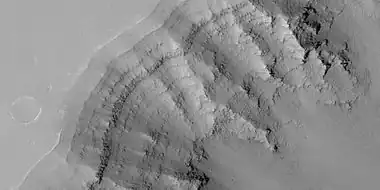 Close view of layers in Louros Valles, as seen by HiRISE under HiWish program Note this is an enlargement of a previous image.