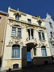 Mix of Art Nouveau and Gothic Revival – Rue Gustave-Lemaire no. 51 in Dunkerque, France, with pointed arched-dormer windows and balcony loggia, unknown architect, decorated with sculptures by Maurice Ringot (1903–1910)