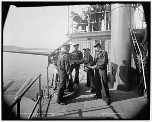 A 6-pounder gun and crew aboard the USS Oregon.