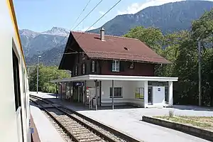 Three-story building with gabled roof