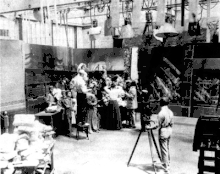 Image 2A.E. Smith filming The Bargain Fiend in the Vitagraph Studios in 1907. Arc floodlights hang overhead. (from History of film)