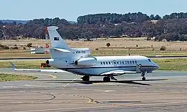 A twin-jet, high-tailplane passenger aircraft painted white above and grey below