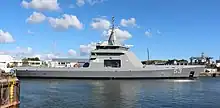 Colour photograph of The offshore patrol vessel ARA Storni in the port of Concarneau (Finistère, Brittany, France).