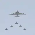 A Boeing E-3 Sentry (AWACS) followed by five Mirages 2000