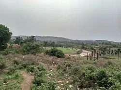 A hill at Gidan Waya with a small river, "Abwum", flowing towards another, "Kabat", both meeting at a confluence in Godogodo