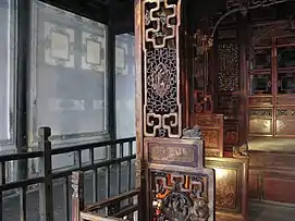 This image demonstrates the openwork carving of a bed frame in Wuzhen