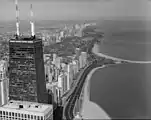 Lincoln Park, looking NNW along North Lake Shore Drive. The Lincoln Park Passerelle is roughly halfway up, opposite North Avenue Bathing Beach at middle-right of frame