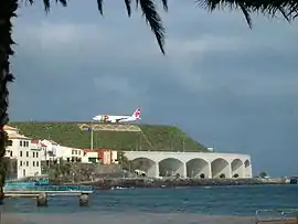 Houses in Santa Cruz, with the arcades of the International Airport in the distance