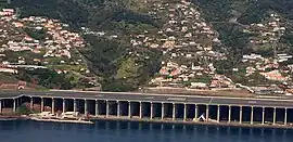 Most of Água de Pena's coast is occupied by Madeira Airport