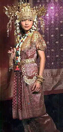 Indonesian girl wearing traditional Palembangese songket