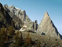 The Aiguilles de Peuterey seen from Val Veny. Aiguille Blanche de Peuterey (extreme left, top), Aiguille Noire de Peuterey (right)