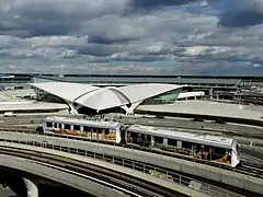 An AirTrain vehicle in front of the TWA Flight Cetner