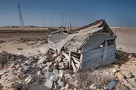 Crumbling wooden building in Al Khuwayr.