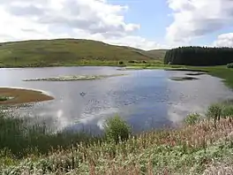 A lake surrounded by hills