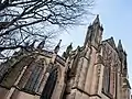 View of the east end including chapel apse, east window and towers