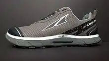 Side view of an Altra trail running shoe.