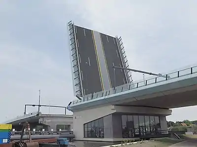 The counterweight is often hidden below the road surface in the bridge abutment.