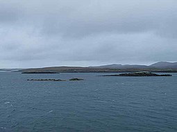 Flodday from the south with the hills east of Loch Portain, North Uist beyond