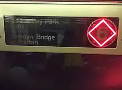 R62A LED destination sign set to a red diamond (for express trains)