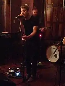 Anderson East performing at the Renwick Mansion in Davenport, Iowa