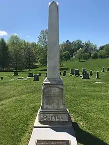 tall gravestone like miniature Washington Monument with Small written at bottom