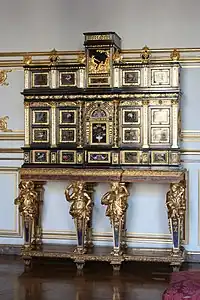 Baroque caryatids of a cabinet; c.1675; ebony, kingwood, marquetry of hard stones, gilt bronze, pewter, glass, tinted mirror and horn; unknown dimensions; Museum of Decorative Art, Strasbourg, France