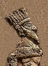 Prisoner king (detail). He appears to be wearing a crown.