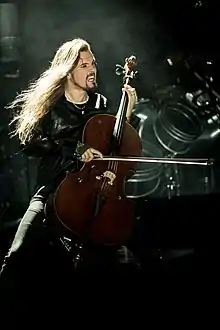 Finnish cello player Perttu Kivilaakso with mid-back length hair