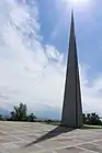 Memorial spire and its shadow