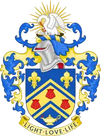 Arms of Southlands College. Shield: Azure, on a chevron cotised between in chief two fleurs-de-lys and in base a lamp Or inflamed proper, three escallops gules; crest: On a wreath of the colours, In front of a demi sun Or a pelican in her piety proper; motto: Light, love, life.