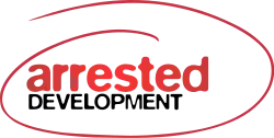 The words "Arrested Development" in red and black lettering