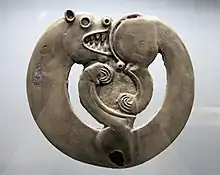 Curled-up feline animal from Arzhan-1, circa 800 BCE. This is the earliest known of a common animal art design.