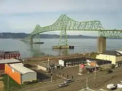 City of Astoria, Oregon in the foreground with the Astoria–Megler Bridge spanning the Columbia River to Washington State