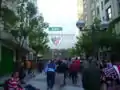 Outside the stadium, with the large painted club crest on the facade viewed from Pozas