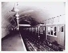 A rapid transit train in an arched underground station