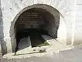 The fountain under the entrance of the Church