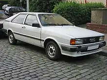 Three-door car with steel wheels and door mirrors